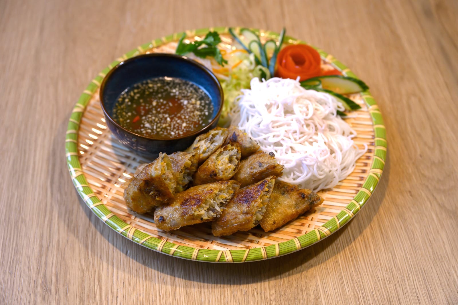 Bún chả nem — rice vermicelli with crispy spring rolls, grilled meat, peanuts and nước chấm