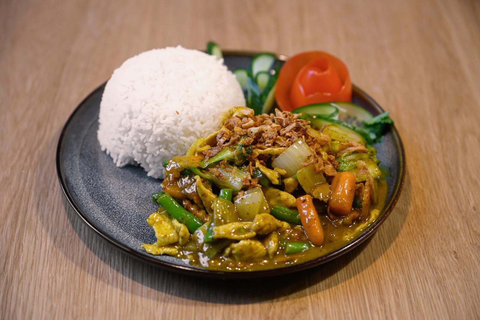 Cà ri — chicken curry with carrot, chilli and star anise, served with steamed rice